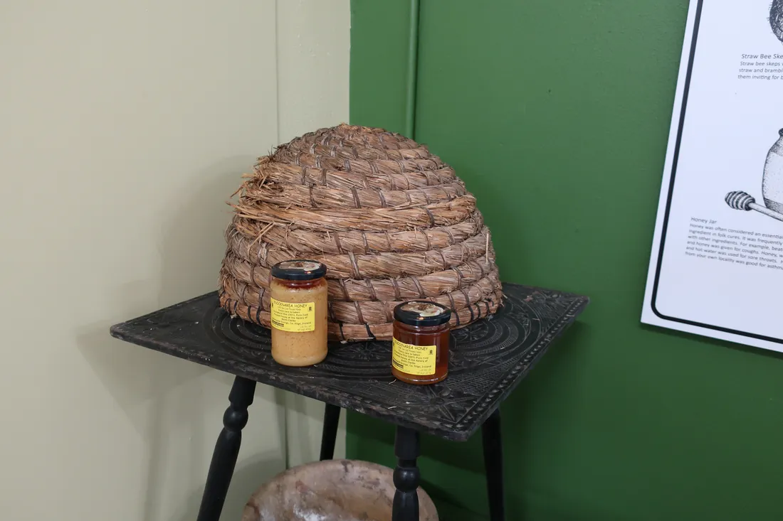 A bell-shaped woven-straw skep beehive