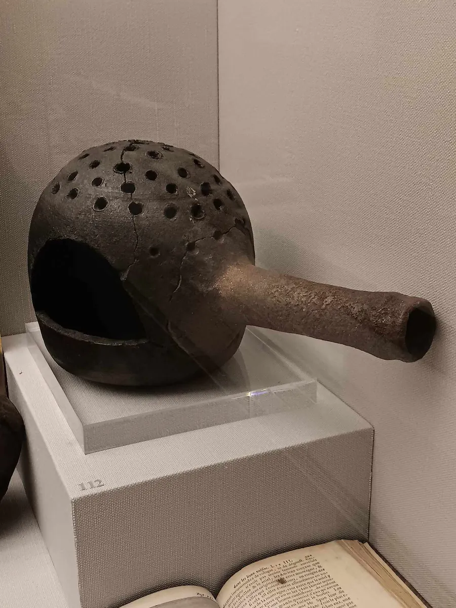 An ancient clay bee smoker, a museum object