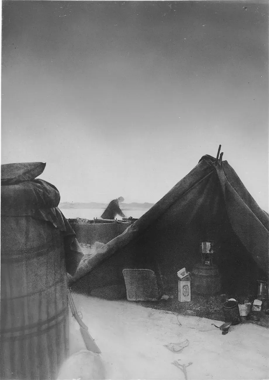The camp at the landing place: the basket on the left, the tent on the right, the boat between.