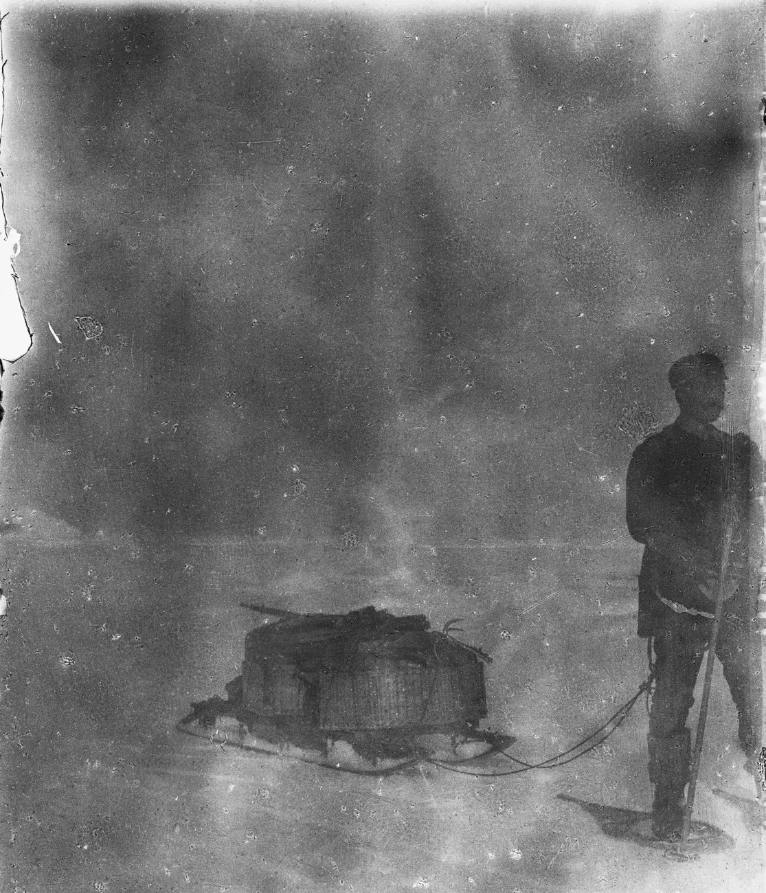 Strindberg hauls a loaded sledge; the only picture with snowshoes in use.