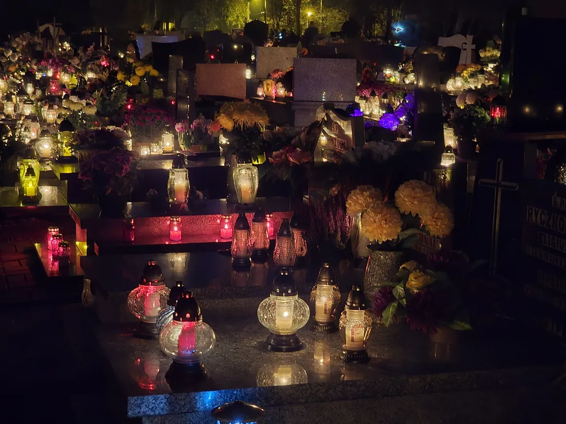 Lit candles on graves