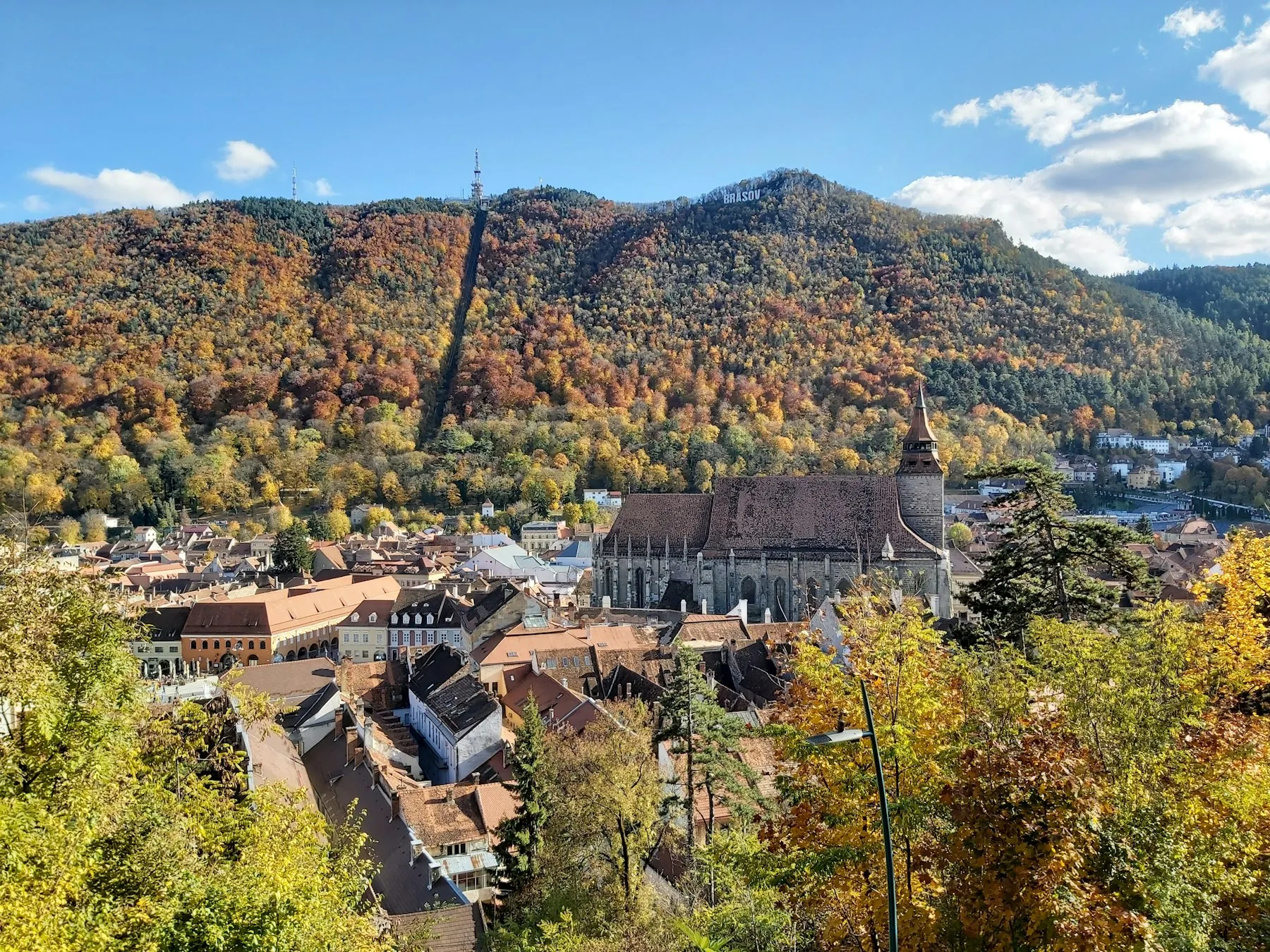 Brașov today, in autumn: the Black Church and the roofs of the centre, with Tâmpa behind