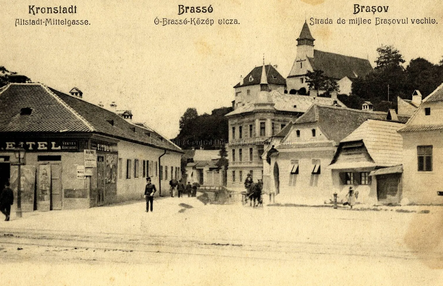Postcard: a wide street with old houses and a building with a tower
