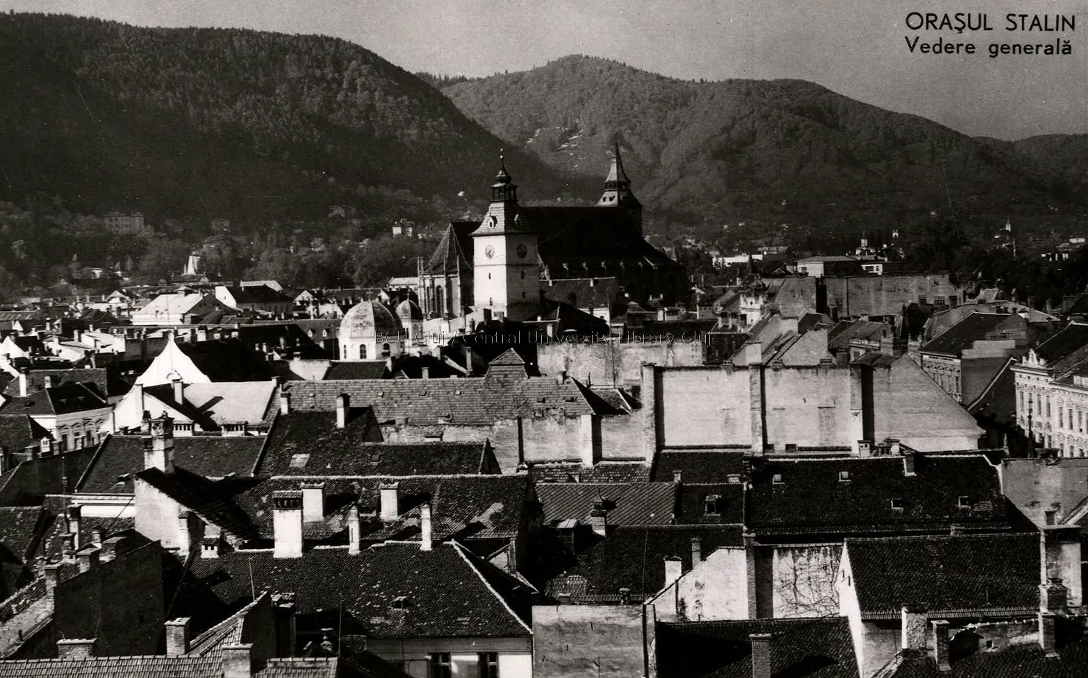 Black-and-white illustrated card: the roofs of the old city, the Black Church and the mountains