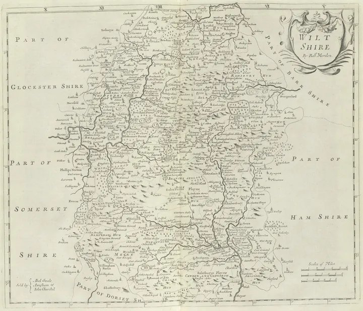 Engraved county map with hatched downland, dotted roads and an ornamented cartouche in the corner