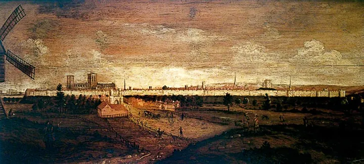 Engraved prospect of a walled medieval city seen from across a river, its minster towers rising above the walls