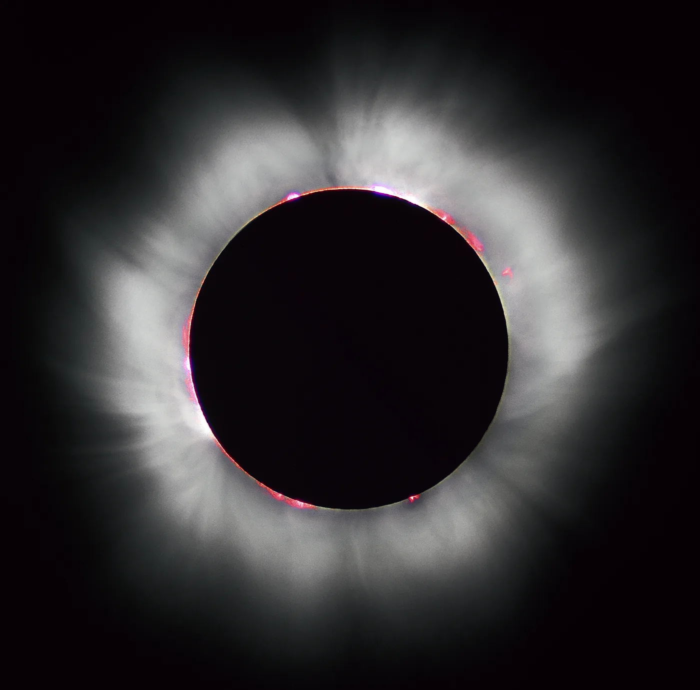 The Sun's white corona around the Moon's black disc, in totality