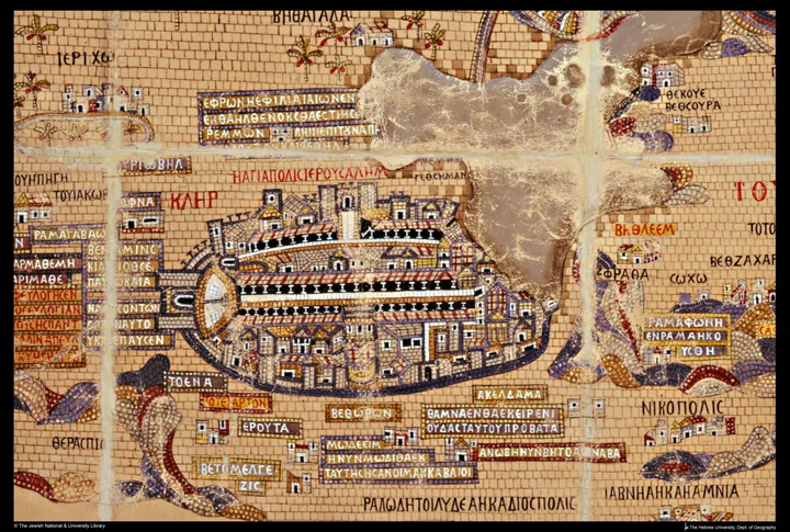 A mosaic detail: an oval walled city with a colonnaded street and a large church with a red roof.