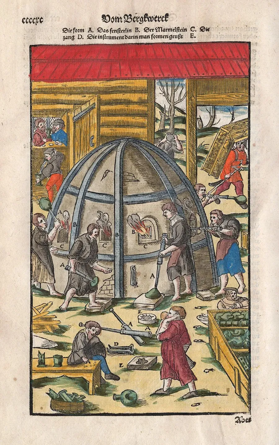 A medieval glass furnace with workers