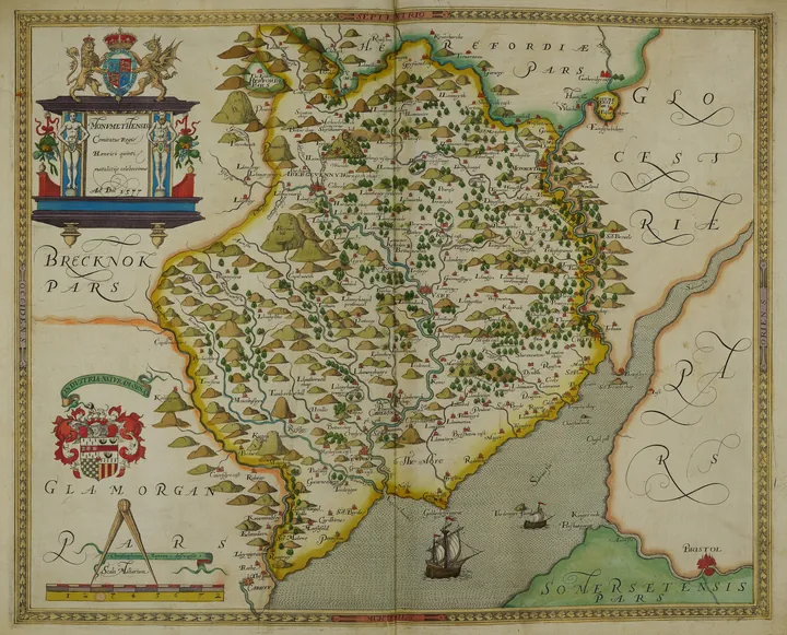 Engraved map of a Welsh county, with hatched mountains and the coastline drawn along the bottom