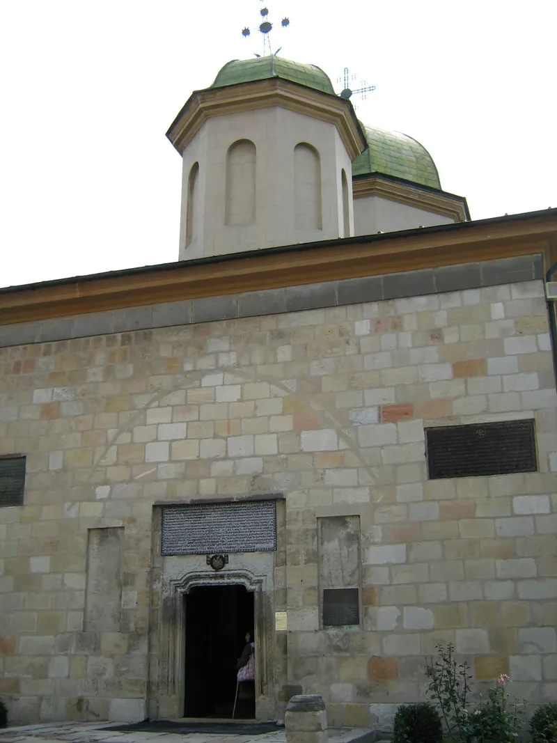 The church entrance, with old stones set into the masonry