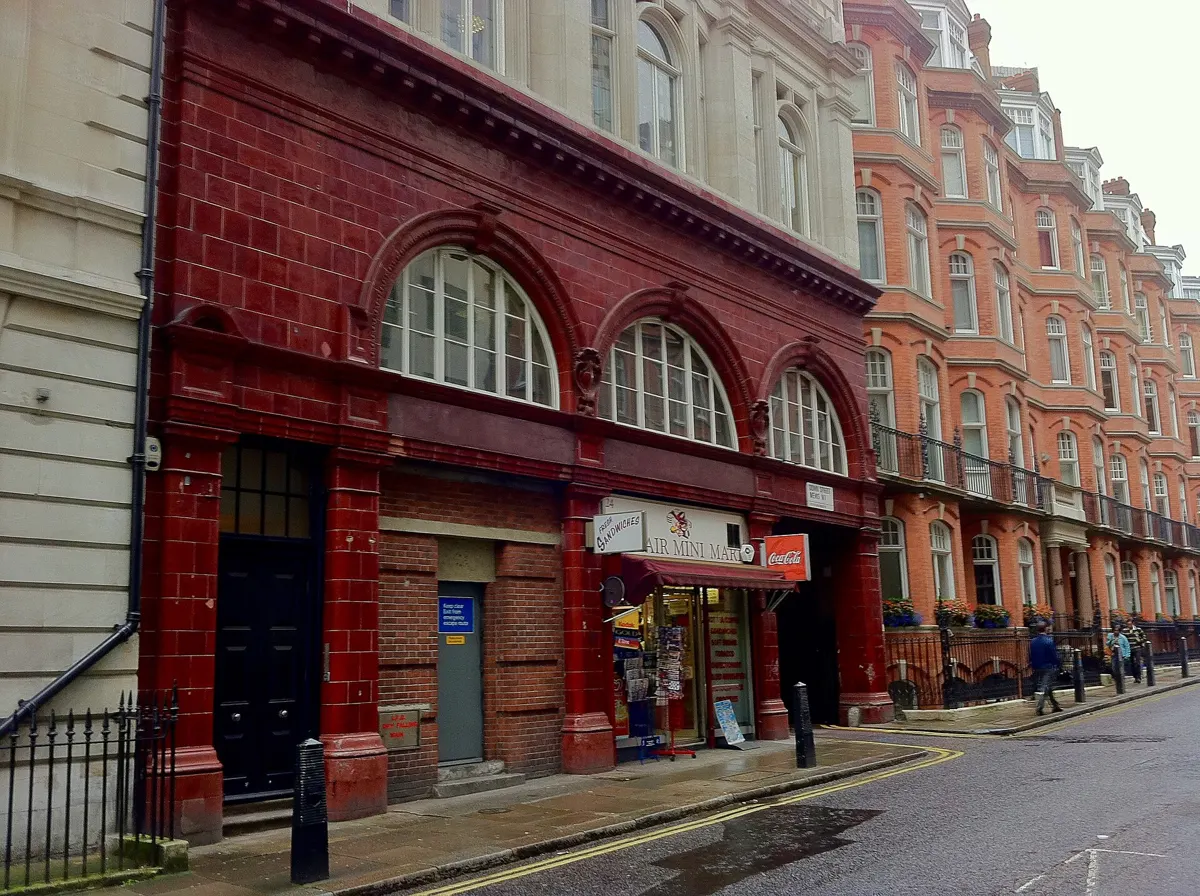 The oxblood-tiled front of Down Street station, now shops, on Down Street in Mayfair.