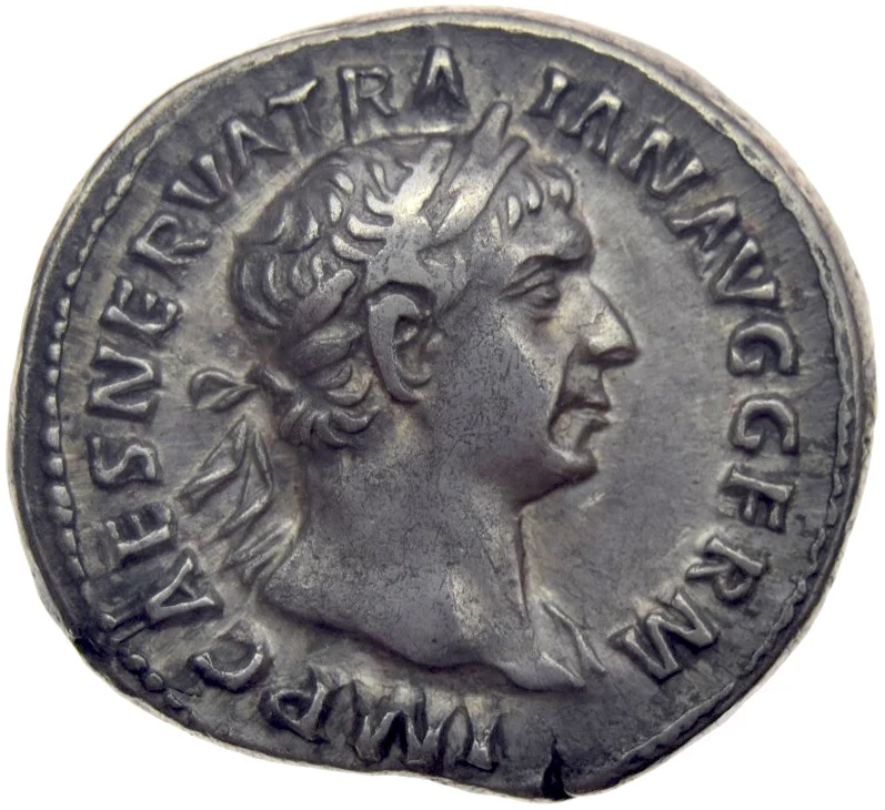 Denarius of Trajan, minted in Rome in 101–102. The photographed coin has no documented connection to the finds in the catalogue.