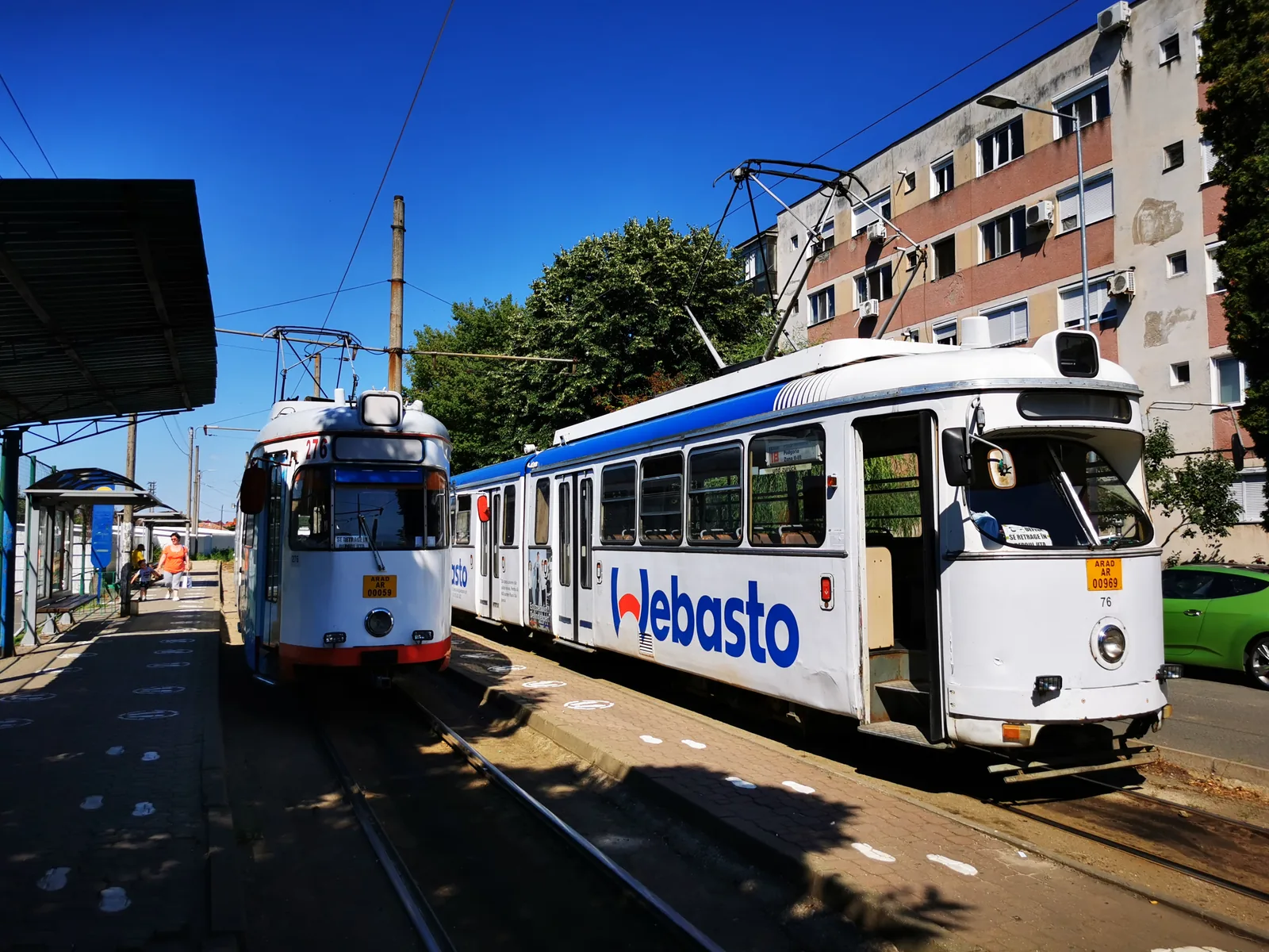 Two CTP Arad trams at a city stop