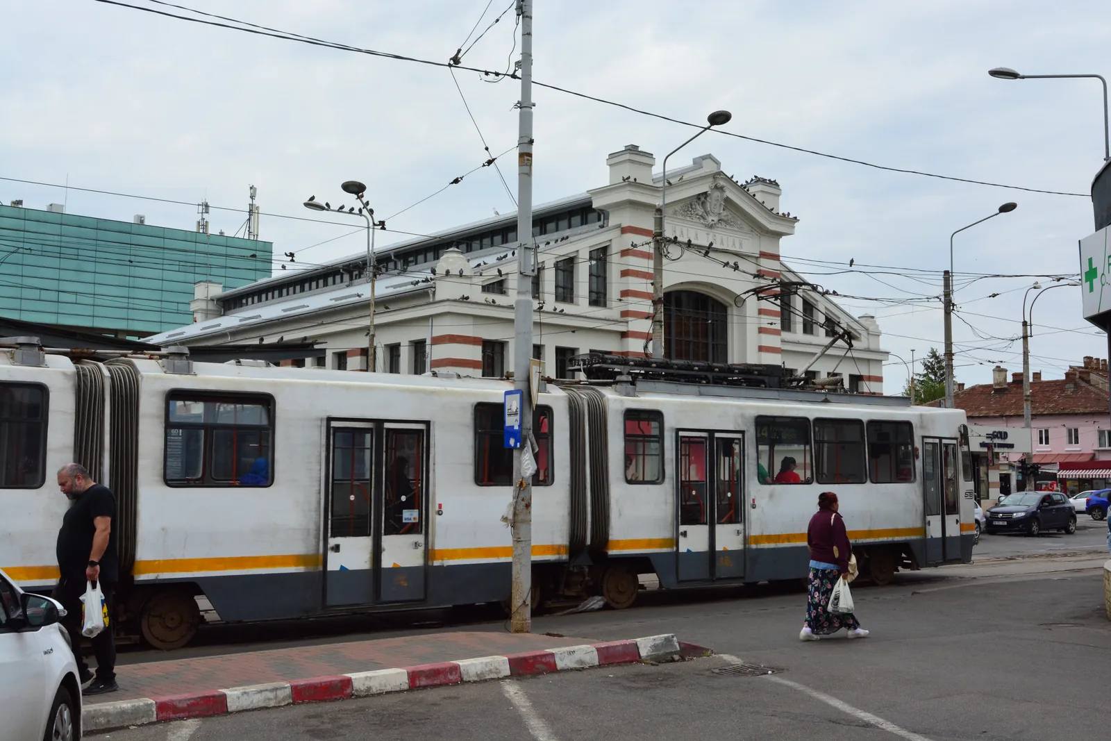 A tram stopped in front of Hala Traian in Bucharest
