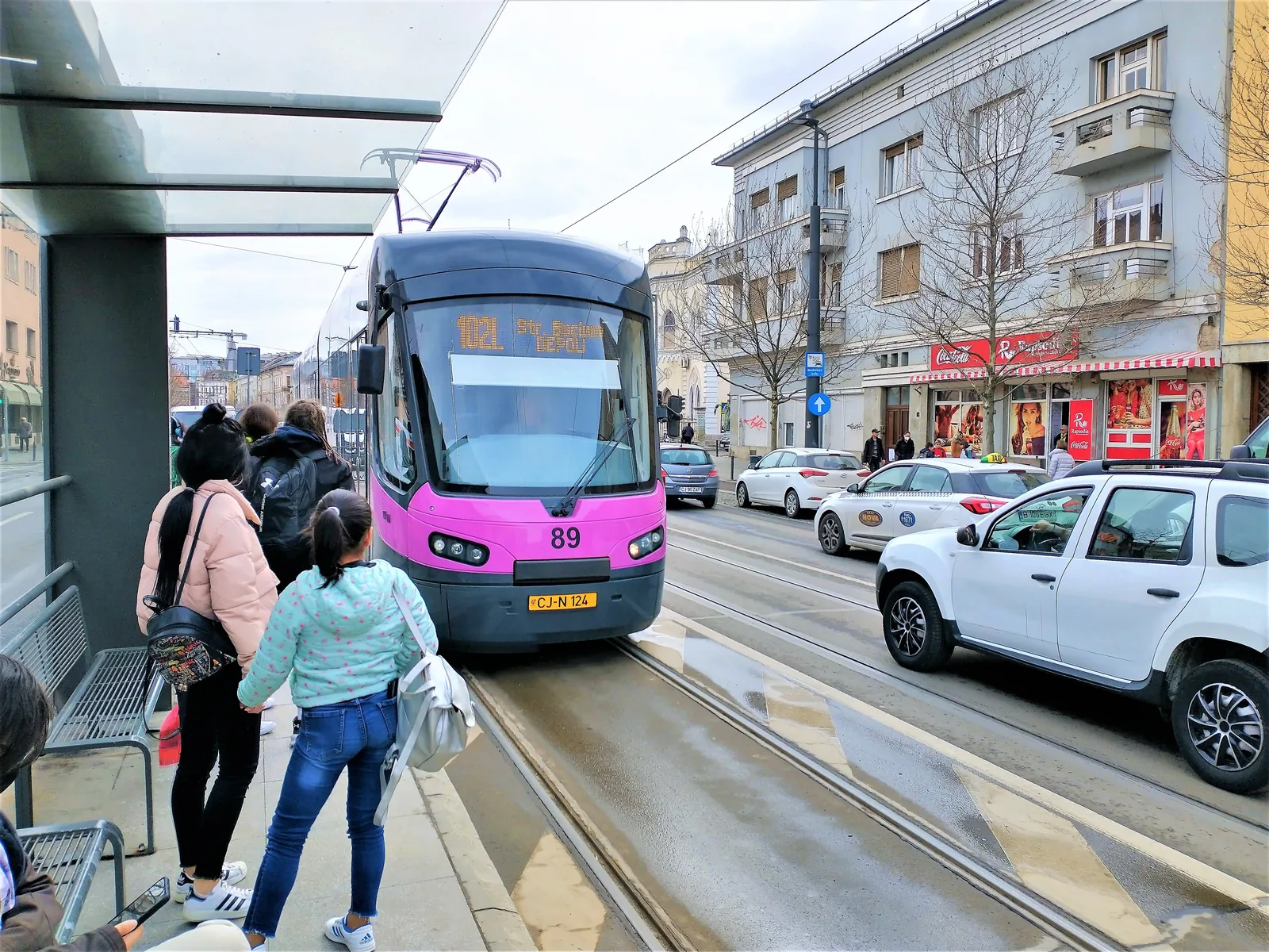 Passengers boarding an Astra Imperio tram in Cluj-Napoca