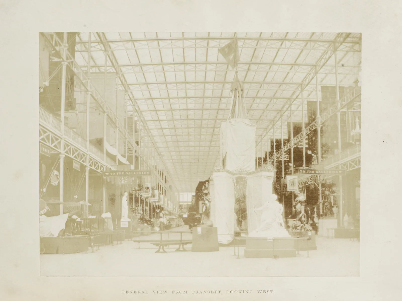 The Crystal Palace transept in 1851, with the glass roof and the exhibits still sheeted
