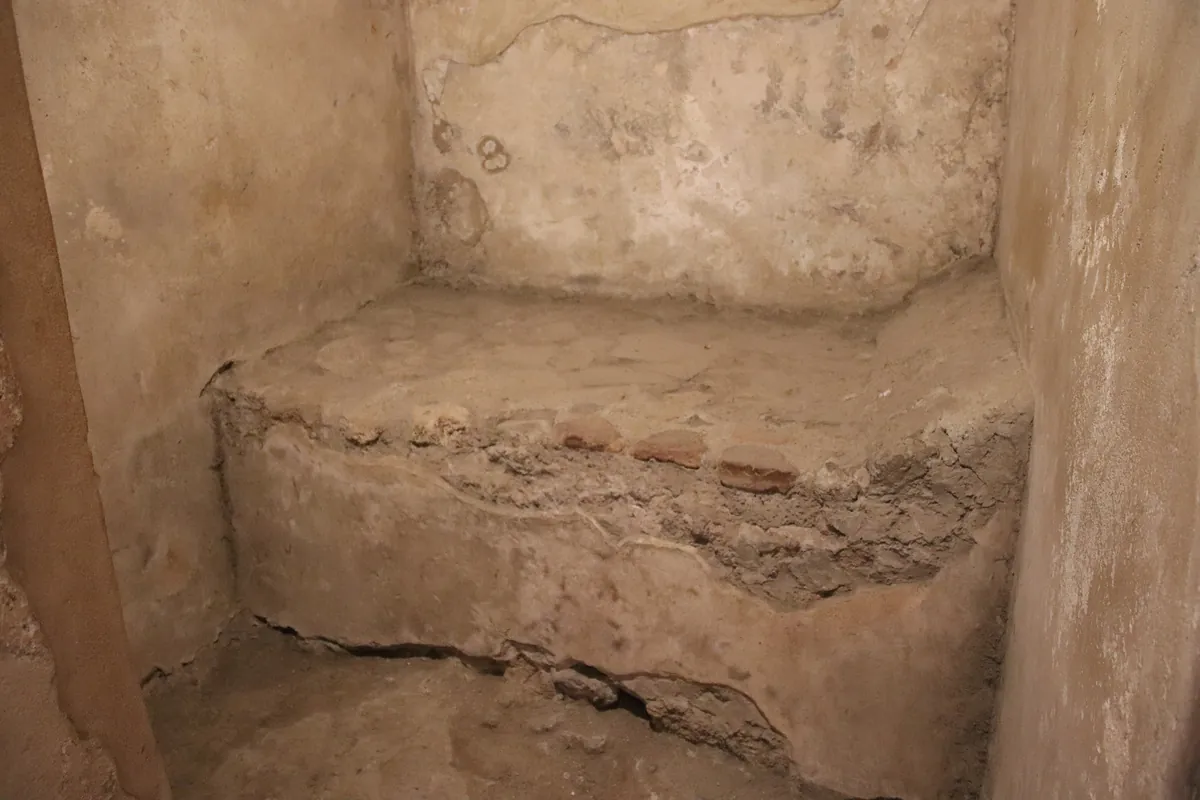 A room in the brothel, with its masonry bed.