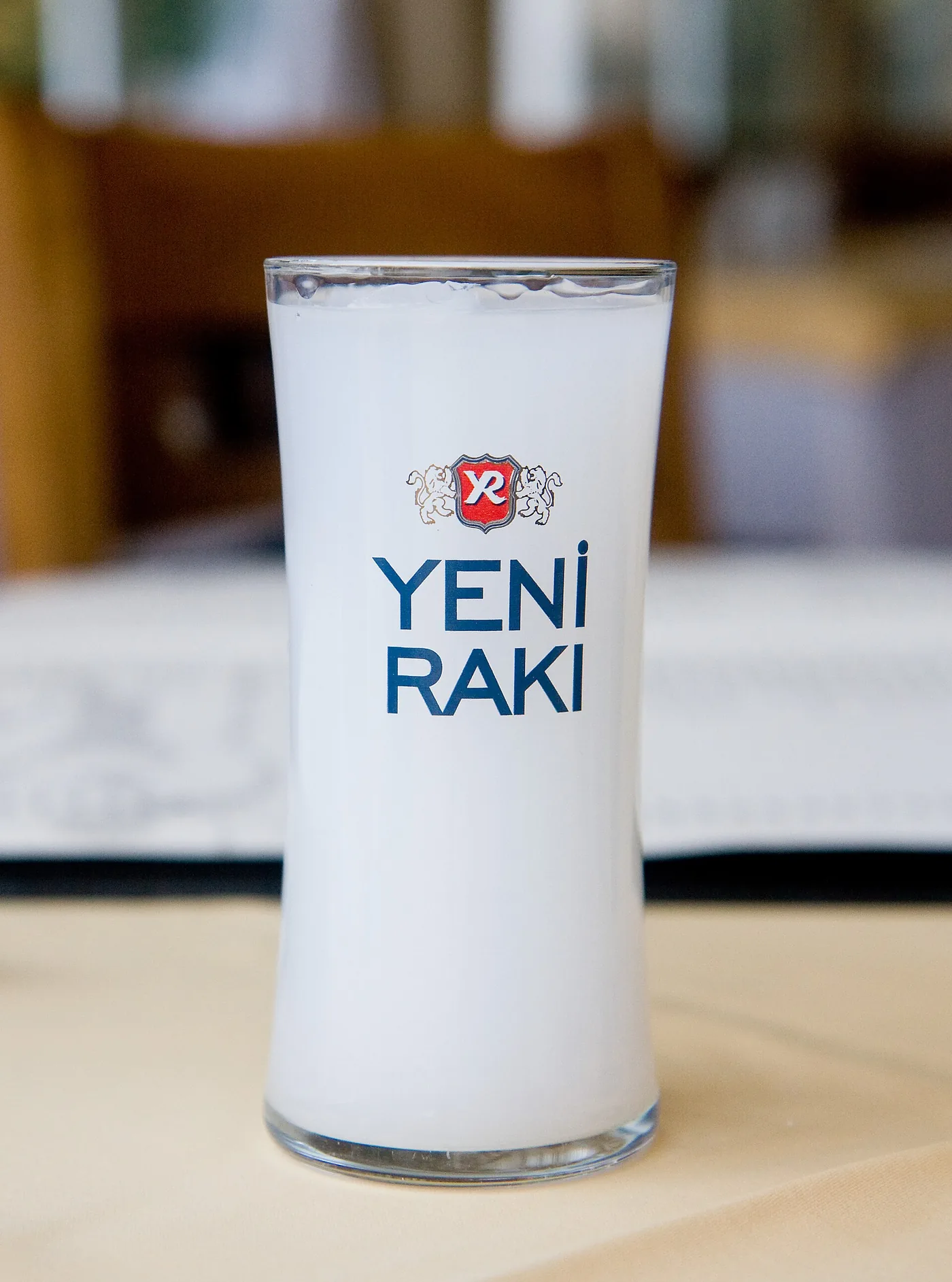 A glass of rakı with water and ice