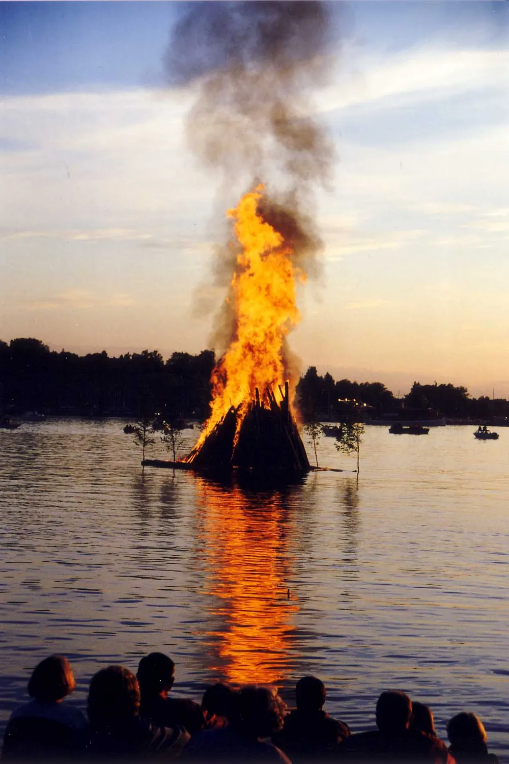 A Sânziene fire on the water, in Finland: the custom burns across Europe.