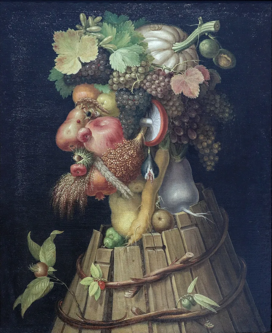 A man’s head in profile made of grapes, pears, a pumpkin and other fruit, on a body made of a broken barrel.