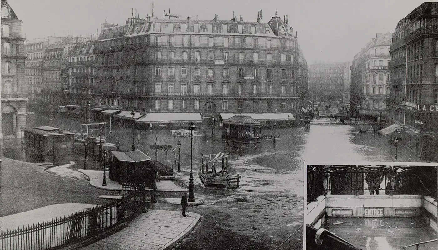 The square in front of the Gare Saint-Lazare under water, with kiosks and lamp posts standing in it; an inset shows a flooded Métro entrance.