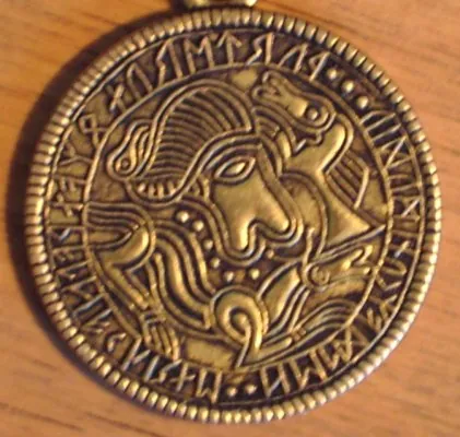 A Migration-period gold bracteate found at Tjurkö, Sweden (a replica is shown).
